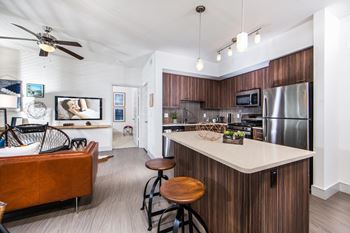 Fitted kitchen with island dining